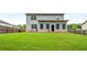 Spacious backyard with a well-maintained lawn and a fenced border at 510 Curry Ridge Ct, Locust Grove, GA 30248