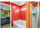 Bathroom with separate tub and shower and views to the main bedroom through the open door at 510 Curry Ridge Ct, Locust Grove, GA 30248