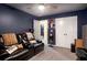 This bedroom features a ceiling fan, cozy seating, and ample closet space at 510 Curry Ridge Ct, Locust Grove, GA 30248