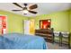 Bright bedroom with ceiling fan, accent wall and rustic wood dresser with mirror at 510 Curry Ridge Ct, Locust Grove, GA 30248