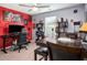 Stylish bedroom/office with a gaming chair, desk, a chess table, and unique decor at 510 Curry Ridge Ct, Locust Grove, GA 30248