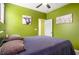 Serene bedroom with a comfortable bed, soft lighting, and artwork, creating a relaxing and inviting space at 510 Curry Ridge Ct, Locust Grove, GA 30248