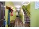 Inviting entryway with stylish decor, wood floors, and a staircase leading to the upper level at 510 Curry Ridge Ct, Locust Grove, GA 30248