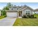 Charming two-story home with brick and gray siding, a well-manicured lawn, and a two-car garage at 510 Curry Ridge Ct, Locust Grove, GA 30248