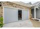 Garage with epoxy flooring and roll down screen at 510 Curry Ridge Ct, Locust Grove, GA 30248