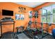 Home gym featuring a treadmill, weight rack and inspirational wall art at 510 Curry Ridge Ct, Locust Grove, GA 30248