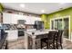 Modern kitchen with granite countertops, stainless steel appliances, and a center island with seating at 510 Curry Ridge Ct, Locust Grove, GA 30248