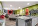 Open-concept kitchen with a view into the adjacent living area, featuring granite countertops and stainless appliances at 510 Curry Ridge Ct, Locust Grove, GA 30248