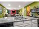 Bright kitchen featuring granite countertops, stainless steel appliances, and an open design to the living area at 510 Curry Ridge Ct, Locust Grove, GA 30248