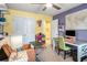 Bright home office featuring a desk, office chair and built in storage shelves at 510 Curry Ridge Ct, Locust Grove, GA 30248