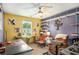 Home office with ceiling fan, desk, comfortable seating and lots of natural light at 510 Curry Ridge Ct, Locust Grove, GA 30248