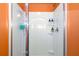 Bright white shower features a modern shower head and built in shelving at 510 Curry Ridge Ct, Locust Grove, GA 30248