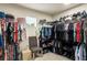 Spacious walk-in closet featuring an organization system, clothing racks and shoe storage at 510 Curry Ridge Ct, Locust Grove, GA 30248