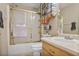 Cozy bathroom featuring a shower with a gold frame, a vanity, and towel racks for convenience at 6076 Chupp Way Ln, Lithonia, GA 30038