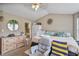 Comfortable bedroom space featuring a vaulted ceiling, natural light, and a closet at 6076 Chupp Way Ln, Lithonia, GA 30038