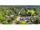 Aerial view of the home in a lush neighborhood near a golf course, highlighting its prime location at 1048 Indian Hills Pkwy, Marietta, GA 30068