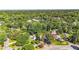 Neighborhood street view featuring the home surrounded by lush trees with city skyline views at 1048 Indian Hills Pkwy, Marietta, GA 30068