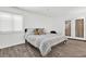 Bedroom with a large window and sliding glass door that provides natural light at 1048 Indian Hills Pkwy, Marietta, GA 30068