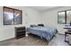 Bedroom showcasing natural light from two windows and wood-look floors at 1048 Indian Hills Pkwy, Marietta, GA 30068