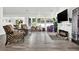 Bright living room with large windows, modern fireplace, and sleek flooring at 1048 Indian Hills Pkwy, Marietta, GA 30068