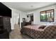 Comfortable bedroom features a window, desk, and ample space at 1048 Indian Hills Pkwy, Marietta, GA 30068