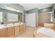 Bright bathroom features double vanity, tub, shower and tile floors at 1107 Park Row South Se, Atlanta, GA 30312