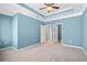 A spacious bedroom with plush carpet, modern ceiling fan, and ample natural light at 1107 Park Row South Se, Atlanta, GA 30312