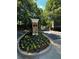 Landscaped entrance to Park Row featuring well-maintained plants and trees. Est 2004 at 1107 Park Row South Se, Atlanta, GA 30312
