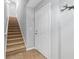 Foyer featuring tile floor, coat rack, stairs and white front door at 1107 Park Row South Se, Atlanta, GA 30312