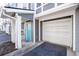 Exterior showcasing attached garage and blue front door at 1107 Park Row South Se, Atlanta, GA 30312