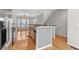 Open kitchen featuring stainless appliances, breakfast bar with decorative accents, and hardwood floors at 1107 Park Row South Se, Atlanta, GA 30312