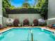 Relaxing community pool with lounge chairs and umbrellas at 1107 Park Row South Se, Atlanta, GA 30312
