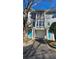 Townhome exterior with garage and bright blue doors at 1107 Park Row South Se, Atlanta, GA 30312
