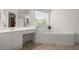 This bathroom features a corner tub, vanity area, and neutral walls at 4108 Wyndam Hill Dr, Suwanee, GA 30024