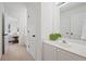Modern bathroom with white cabinets, a large mirror, and stylish fixtures at 4108 Wyndam Hill Dr, Suwanee, GA 30024