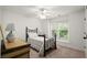 This bedroom features a ceiling fan, window with blinds, and neutral walls at 4108 Wyndam Hill Dr, Suwanee, GA 30024