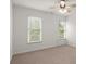 This bedroom features a ceiling fan, large windows with blinds, and neutral walls at 4108 Wyndam Hill Dr, Suwanee, GA 30024