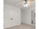 This bedroom features a ceiling fan, closet, and en-suite bathroom at 4108 Wyndam Hill Dr, Suwanee, GA 30024