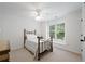Cozy bedroom with a twin bed, window seat, and ample natural light at 4108 Wyndam Hill Dr, Suwanee, GA 30024
