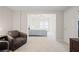 Comfortable bedroom with view to living area and carpeted floors at 4108 Wyndam Hill Dr, Suwanee, GA 30024