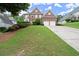 Charming two-story brick home with well-maintained landscaping and a wide driveway at 4108 Wyndam Hill Dr, Suwanee, GA 30024