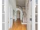 Grand foyer featuring hardwood floors, a staircase, and French doors leading to an office at 4108 Wyndam Hill Dr, Suwanee, GA 30024