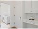 Convenient laundry area featuring modern appliances and ample space at 4108 Wyndam Hill Dr, Suwanee, GA 30024