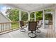 Screened-in porch with seating provides a perfect outdoor dining or relaxation area at 4108 Wyndam Hill Dr, Suwanee, GA 30024