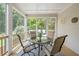 Screened-in porch with stylish outdoor furniture, perfect for relaxing and enjoying the fresh air at 4108 Wyndam Hill Dr, Suwanee, GA 30024