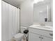 Bright bathroom with vanity and shower with curtain at 537 Garnet Dr, Acworth, GA 30101