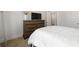 Serene bedroom with a plush bed, neutral tones, and a large dresser at 537 Garnet Dr, Acworth, GA 30101