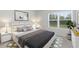Bright bedroom with patterned rug, a large window, and stylish decor at 537 Garnet Dr, Acworth, GA 30101