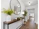 Welcoming entryway featuring a stylish console table with decorative accents and a large round mirror at 537 Garnet Dr, Acworth, GA 30101