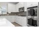 Well-equipped kitchen featuring stylish backsplash and stainless steel appliances at 537 Garnet Dr, Acworth, GA 30101